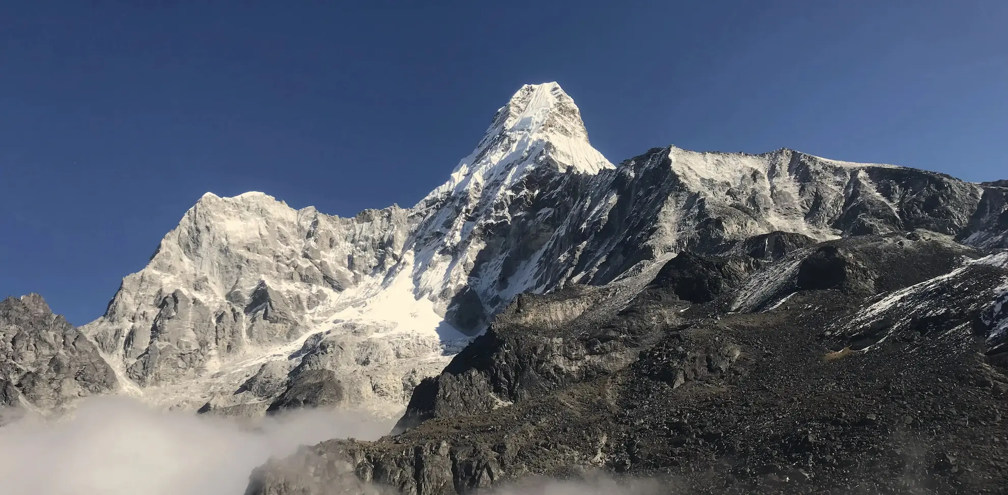 Snow-covered Ama Dablam peak towering above base camp in the Everest region