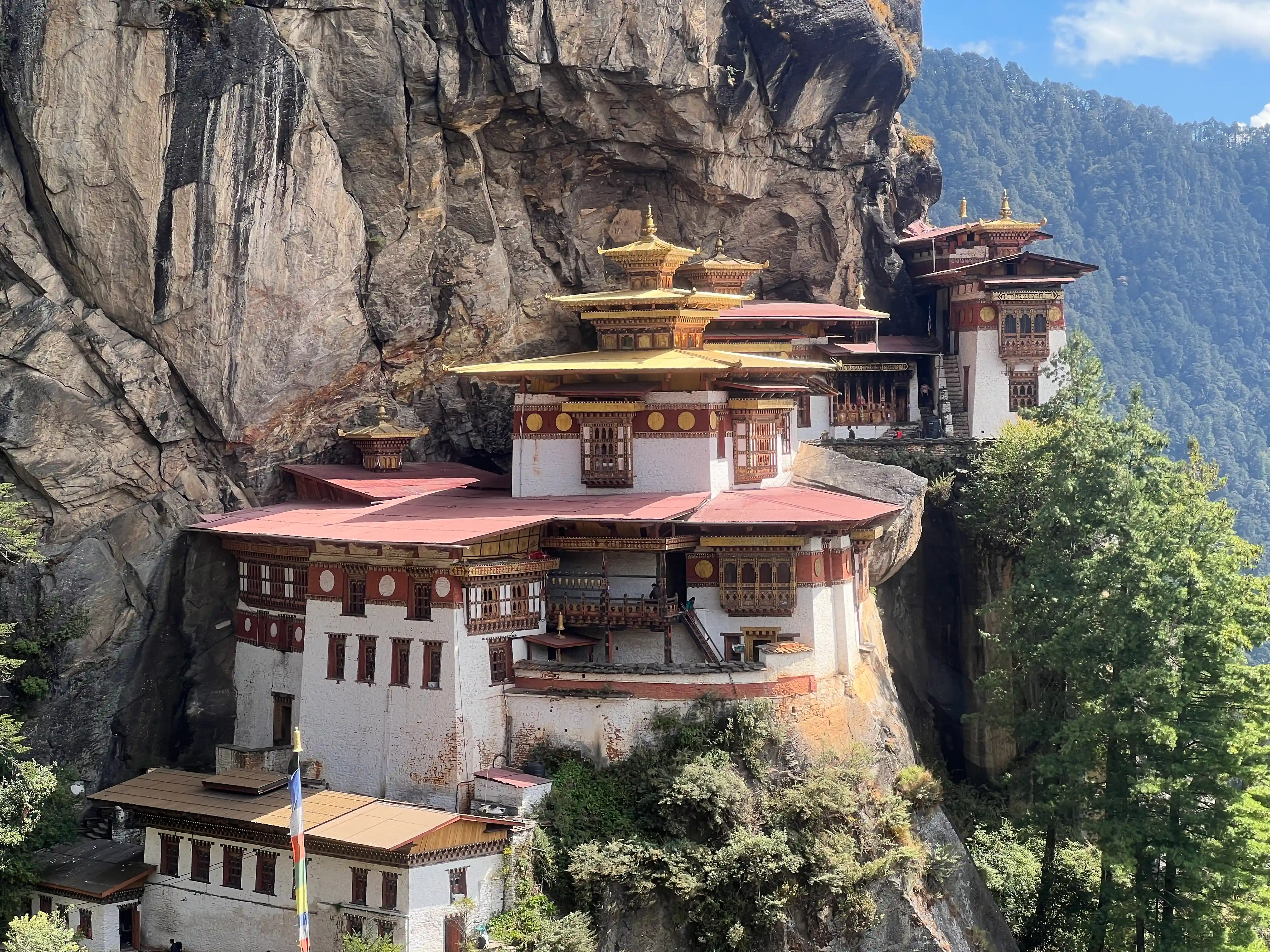 Travelers visiting the Tiger’s Nest Monastery during a cultural tour in Bhutan